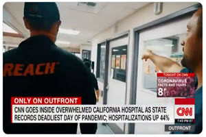 screenshot of CNN Outfront news story showing two medical workers in the ER hallway