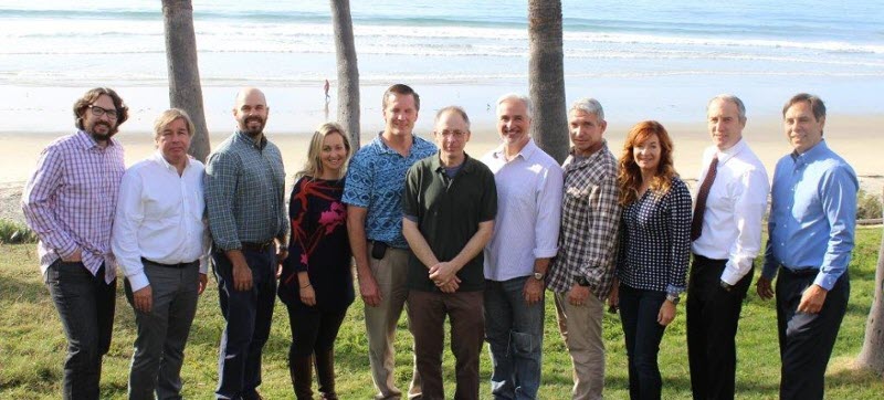dem hyperbaric medicine faculty standing outside in front of the ocean 